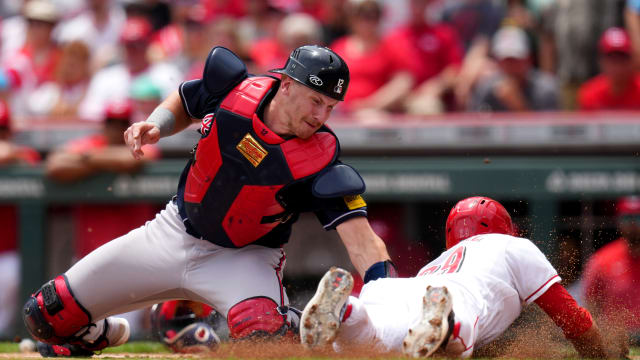 Jun 25, 2023; Cincinnati, Ohio, USA; Atlanta Braves catcher Sean Murphy (12) tags out Cincinnati Reds center fielder TJ Friedl (29) at home plate in the first inning of a baseball game at Great American Ball Park. Mandatory Credit: Kareem Elgazzar-USA TODAY Sports